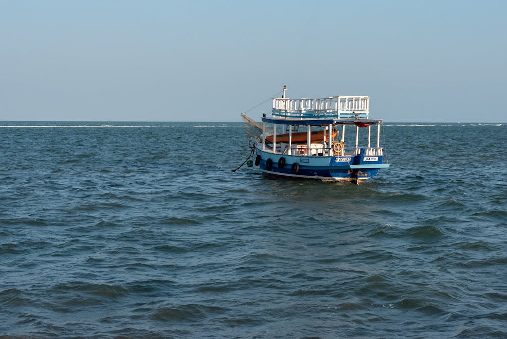 Juntos Seguros ICE A tranquil boat floating on the blue waters of Porto Seguro, Brazil.
