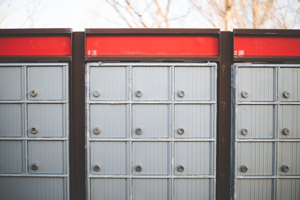 The Globe and Mail Image of secure outdoor community mailboxes with individual lockers in a row.