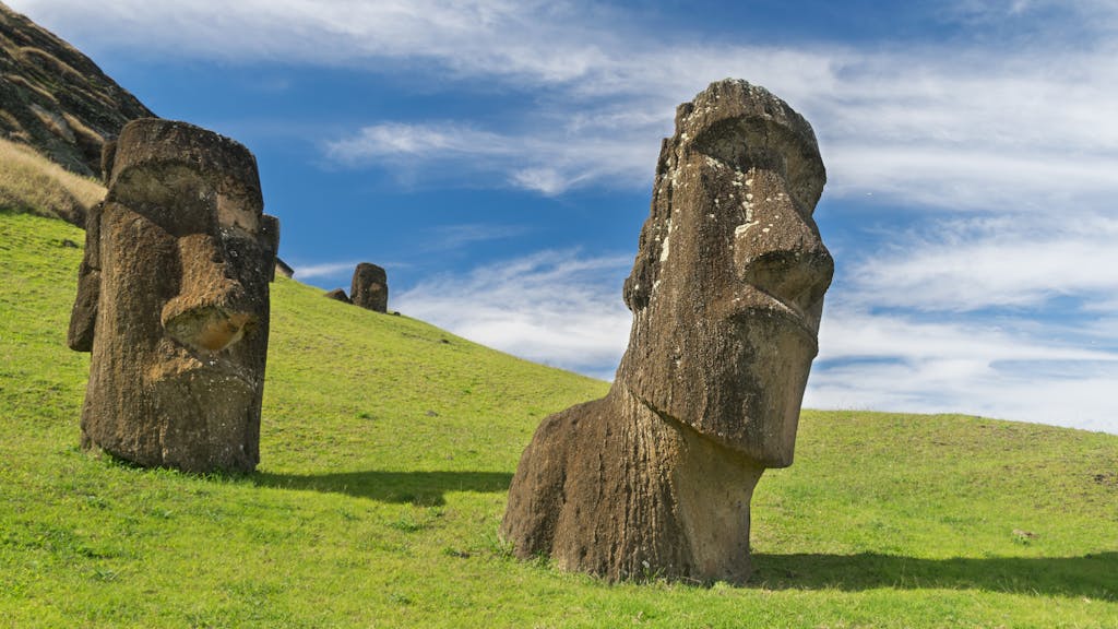 Dojen Moe Majestic Moai statues on Easter Island with clear blue skies overhead.